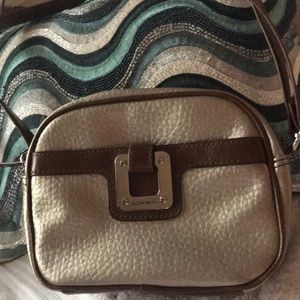 Small Pewter and Brown bag with side pockets.